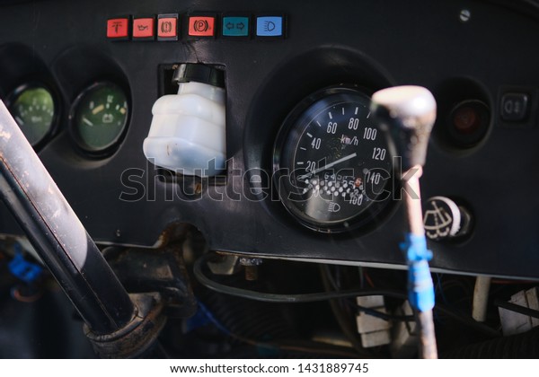 the\
interior of an old car with controls and\
sensors