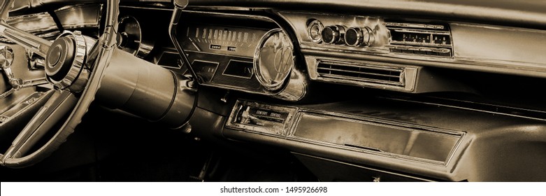 Interior of old classic American car from fifties. Toned stylized image of dashboard in classical US automobile. Panorama view. - Powered by Shutterstock