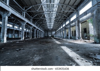 Interior Of Old Factory Buildings Destroyed. Ruins Of Industrial Enterprise, Dark Debris Destroyed Factory Premises In Factory As Result Of Economic Crisis And Earthquake.