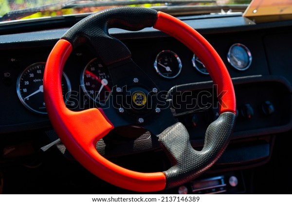 Interior of an old veteran car. Old stylish\
steering wheel.