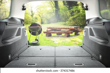 Interior Of Open Car Trunk And Garden And Grill 