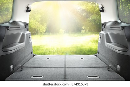 Interior Of Open Car Trunk With Green Landscape 