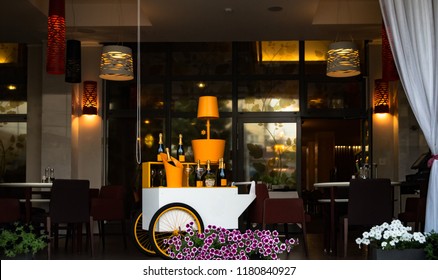 Interior Of An Open Restaurant, A Trolley With Drinks