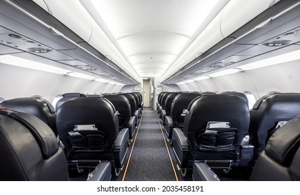Interior of the passenger airplane with leather seats.