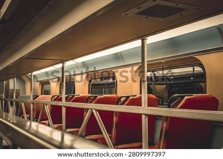 Interior perspective showing the view from inside a distinctive Gallery Car on a Metra commuter train while traveling through the Chicago area.