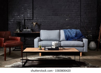 Interior Photograph Of Warehouse Conversion Apartment Lounge Room With Exposed Brick Walls And Modern Furniture