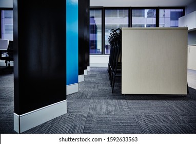 Interior Photography Of Commercial Fit Out Of Office Break Out Area With Kitchen, Modern Graphic Style Room Divider In Black And Teal And Black Stools At A Tall Bench Table