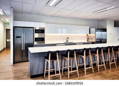 Interior Photography Of A Contemporary Design Corporate Office Kitchen Break Out Area In A City Office Building With Breakfast Bar And Stools With Floor Boards