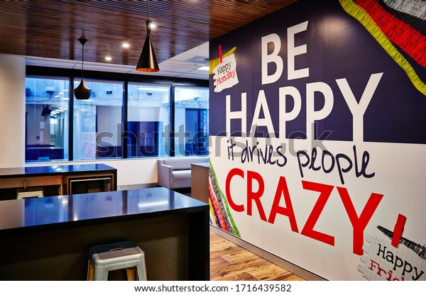  contemporary design corporate office break out area with a cheerful motivational quote wallpaper mural
