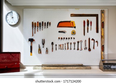 Interior Photography Detail Of A Wall In A Workshop With Tradesman Tools On A Pegboard