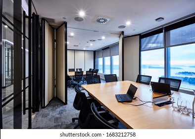 Interior Photography Of A Large Double Corporate Board Room With Concertina Doors, Long Timber Meeting Table, Parquetry Floor And Harbour Views