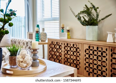 Interior Photography Of Modern Coastal Hamptons Style Open Plan Lounge Room, Details Of Timber Sideboard, Coffee Table, Decorative Objects, Floral Arrangements And Candles