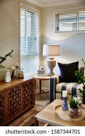 Interior Photography Of Modern Coastal Hamptons Style Open Plan Lounge Room, Striped Sofa, Side Table, Timber Sideboard, Coffee Table, Decorative Objects, Floral Arrangements And Candles