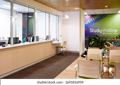 Interior Photography Of The Reception Waiting Area Of A University Head Office With A Receptionist At The Counter Window