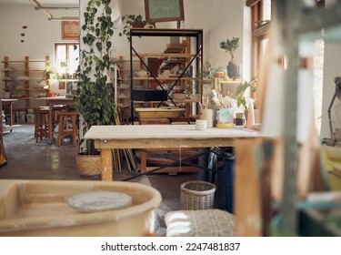 Interior, pottery and workshop of small business in ceramic arts, crafts or creative studio of startup business. Empty work station of a artistic room for clay crafting, paint or molding classroom - Powered by Shutterstock