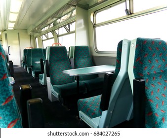 Interior Of A Railway Train Carriage Showing A Table Seat