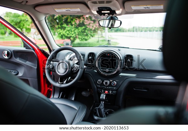 Interior of red\
city car. Small car for\
cities.