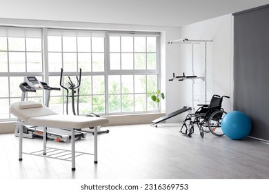 Interior of rehabilitation center with couch and equipment