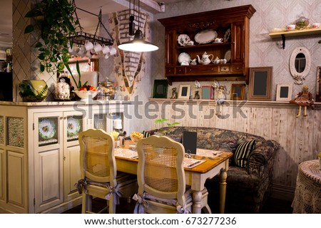 Interior of restaurant in country style. cozy restaurant in French style with empty frames for paintings and photographs on walls