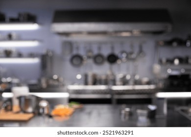 Interior of restaurant kitchen with professional utensils, out of focus, blurred