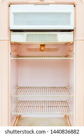 Interior of a retro pink fridge from the fifties