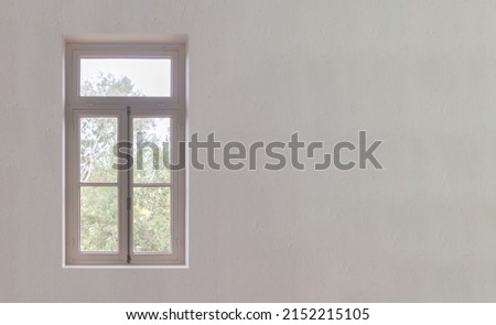 Interior retro wooden tall glass window. White classy closed window with knob on house wall background, front view, copy space