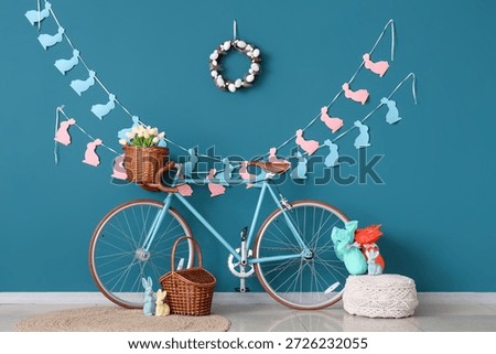 Interior of room decorated for Easter with bicycle, tulips and baskets