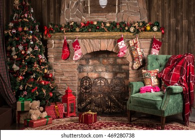 Interior room with elegant Christmas tree, fireplace and a blanket on the couch
