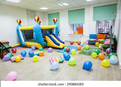 Interior Of Room With Inflatable Trampoline For Children Birthday Or Party