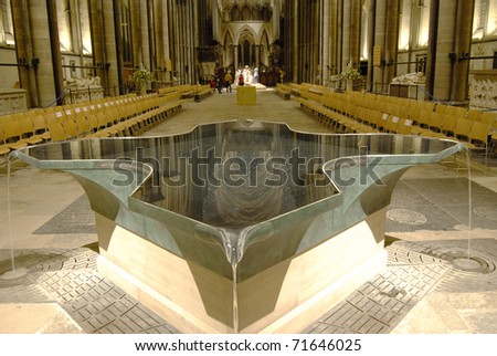 Interior of Salisbury Cathedral with modern font in foreground. Wiltshire. England