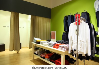 Interior of shop of clothes with fitting rooms