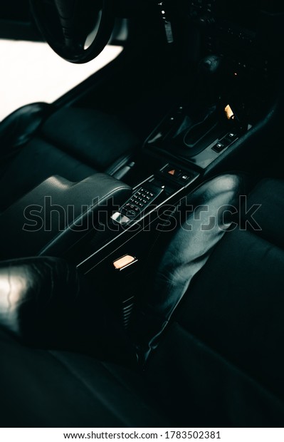 Interior shot of a car with a\
phone