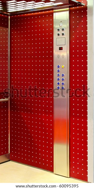 Interior shot of modern\
red elevator car