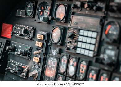 Interior Shot Of An Old Dismissed Air Fighter. Focus On Control Panel, Many Indicators Like Pressure, Altitude, Speed, Wind Force And All Radio Transmissions Dashboard.