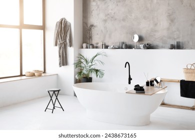 Interior shot of spacious, sunlit bathroom featuring sleek freestanding bathtub, light stylish room with minimalist modern decor and large window with urban views, copy space - Powered by Shutterstock - Get 15% off with code: PIKWIZARD15