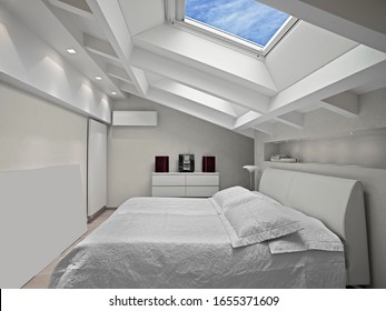 interior shots of a modern bedroom in the mansard in foreground the bed and the skylight