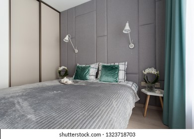 Interior Of A Small Cozy Bedroom With Grey Padded Wall