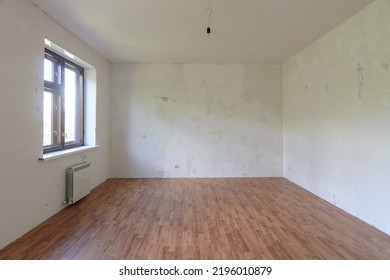 Interior Of A Small Empty Room With One Window During Renovation