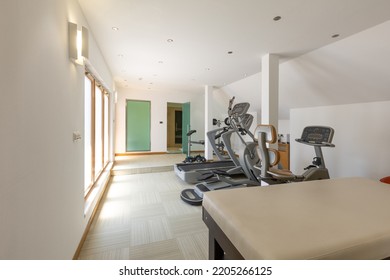 Interior Of A Small Hotel Gym With Equipment