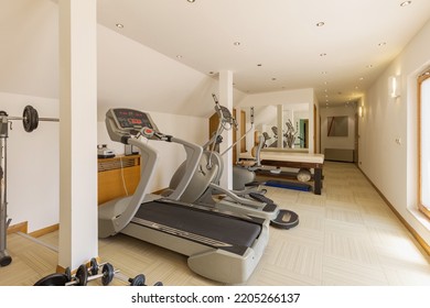 Interior Of A Small Hotel Gym With Equipment