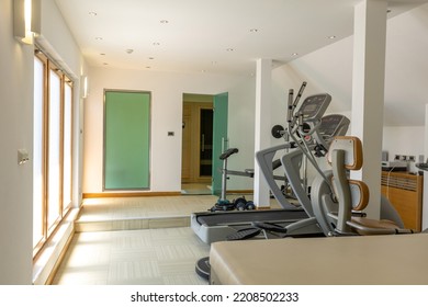 Interior Of A Small Hotel Gym With Equipment