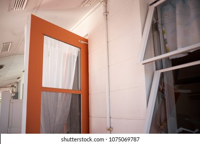 Interior Of A Snowbirds Beach Rental House On Anna Maria Island, Florida With The Windows And Door Open To Air The House