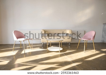 Interior sofa with table and coffee table, in sunlight