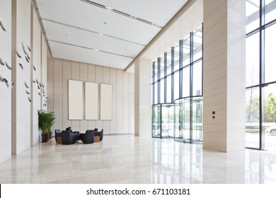 interior of spacious and bright entry hall in modern office building - Shutterstock ID 671103181
