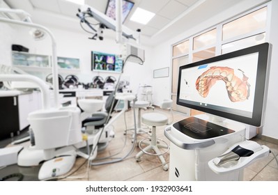 Interior Of Stomatology Cabinet With Modern Equipment, Dental Intraoral Scanner With Teeth On Display. Dental Office With Highly Effective Medical System For Intraoral Scanning. Concept Of Dentistry