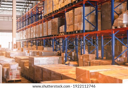 Interior of Storage Warehouse. Package Boxes in Storage with Tall Shelves. Supply Chain. Industry Manufacture Warehousing.
