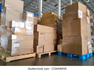 Interior of storage warehouse, stack package boxes on pallets, warehouse industry delivery shipment goods, manufacturing plant shipping logistics and transport