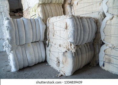 Interior Of A Storehouse .Stacked Waste Textile Scraps In Bales.