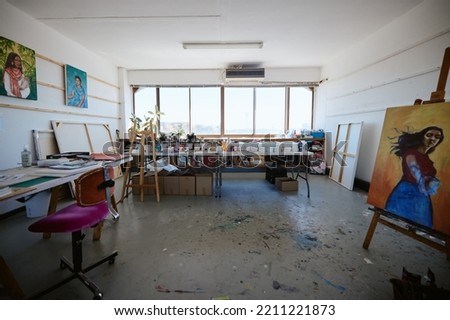 Interior, studio and workshop for art and design production for creative, small business or painting. Manufacturing, professional and service with art supplies and paint equipment warehouse room