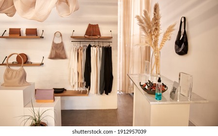 Interior of a stylish boutique full of an assortment of clothing and accessories for sale